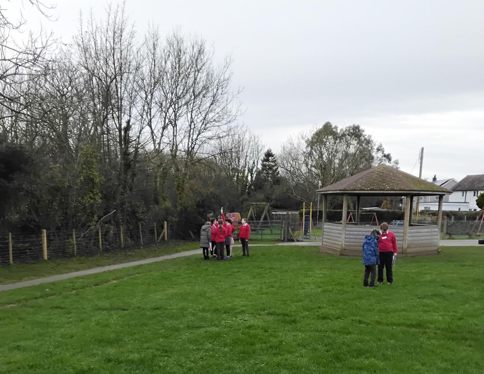 The children surveyed different locations around the school grounds to decide on the best place for a wind turbine.